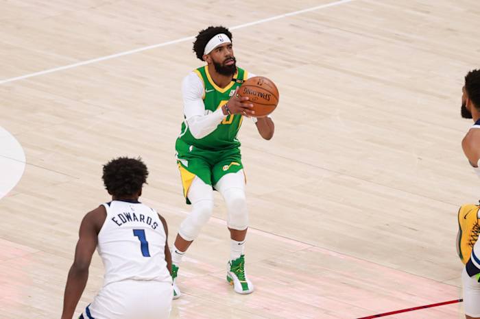 Mike Conley (10) takes a shot against the Minnesota Timberwolves